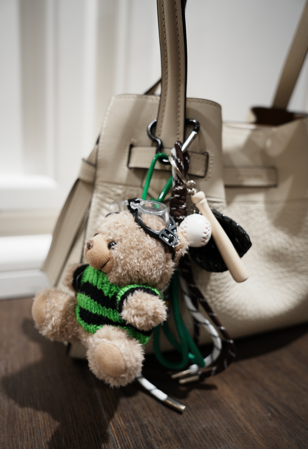 Teddybear w knitted green swater baseball