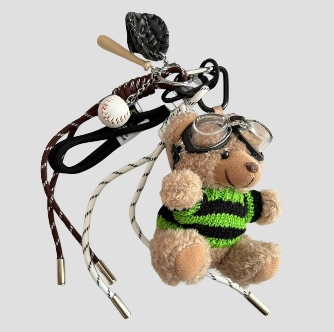 Teddybear w knitted green swater baseball