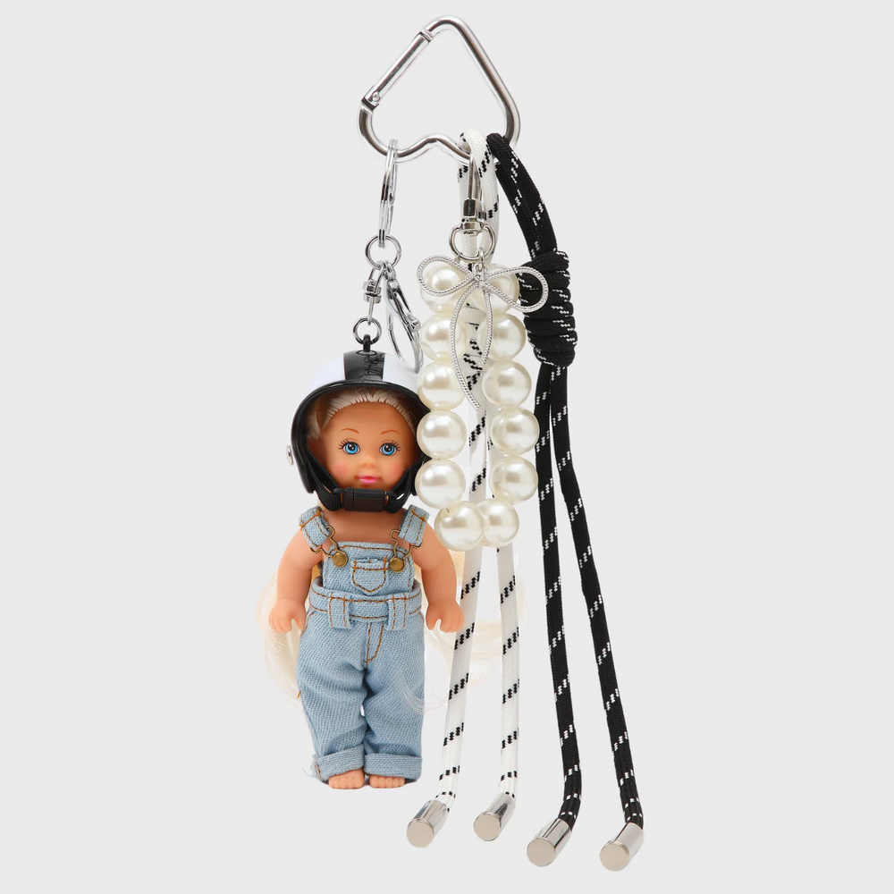 Doll w biker helmet and pearls